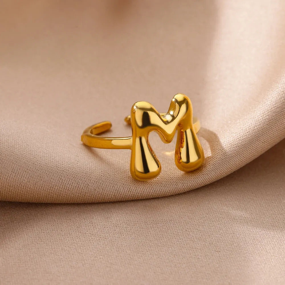 Adjustable personalized ring with initial