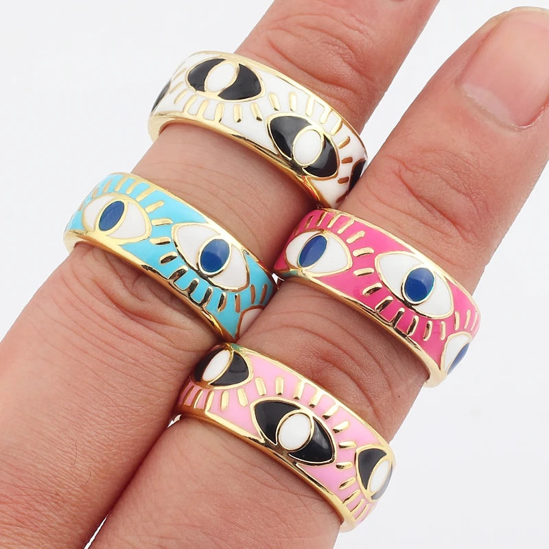 Adjustable enamel ring with gold and white blue eye motifs
