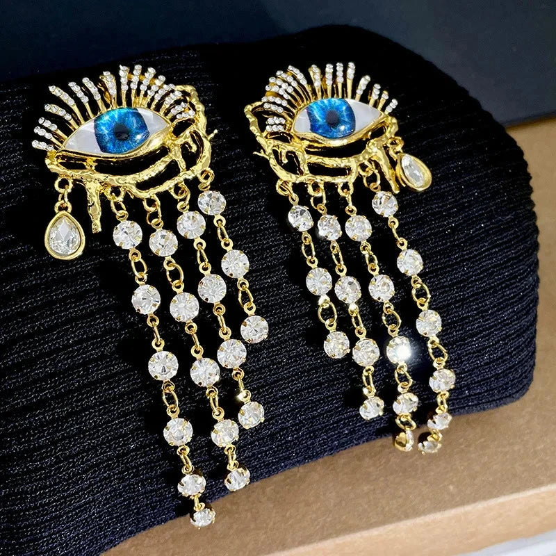 Boucles d'Oreilles Pendantes Oeil Bleu et Strass