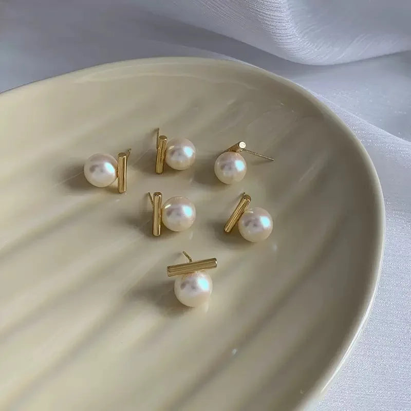 Pearl earrings with geometric bar