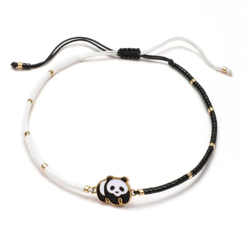 Valge ja musta värvi nöörist Panda käevõru