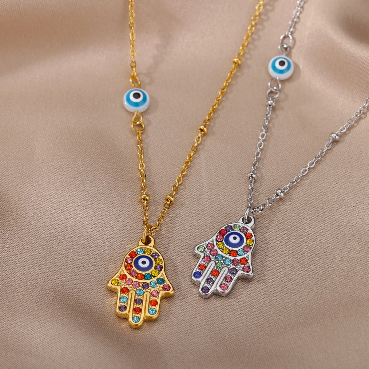 Necklace with multicolored Arabic evil eye protection pendant and Fatma's hand in silver