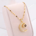 Necklace with "Celestial Eclipse" crescent moon pendant and rhinestones