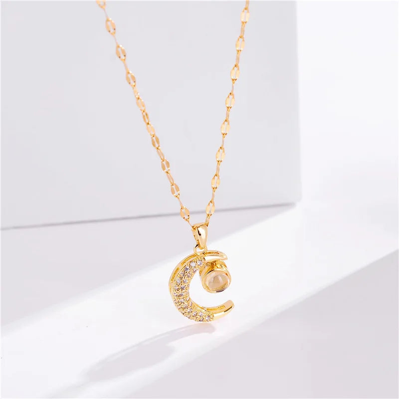 Necklace with "Celestial Eclipse" crescent moon pendant and rhinestones