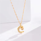 Necklace with "Celestial Eclipse" crescent moon pendant and rhinestones