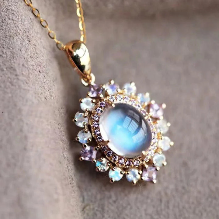 Necklace with oval moonstone pendant and sparkling crystals