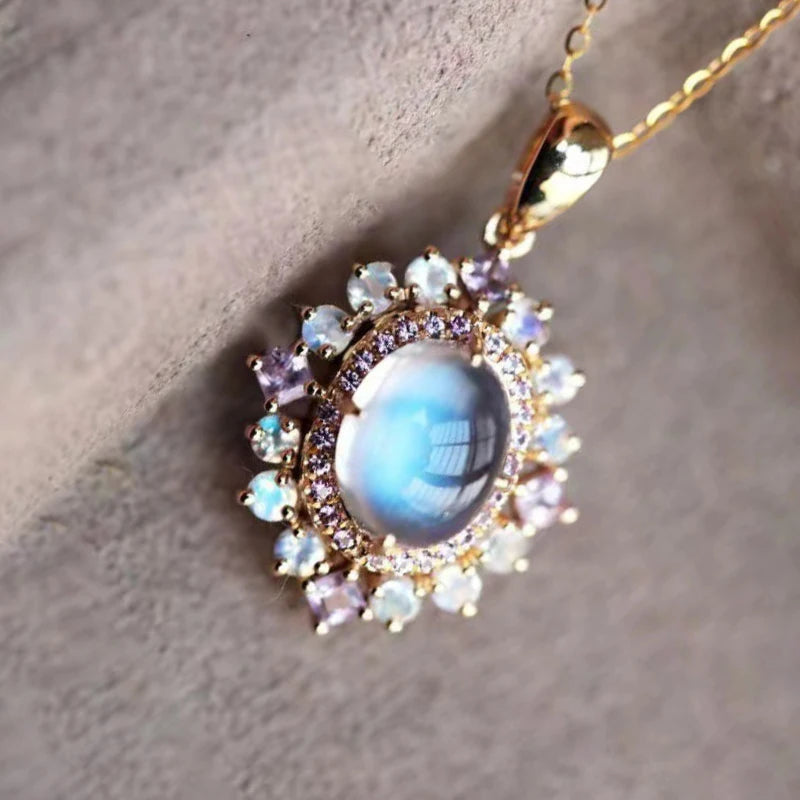 Necklace with oval moonstone pendant and sparkling crystals