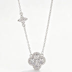 Necklace with clover pendant paved with white crystals