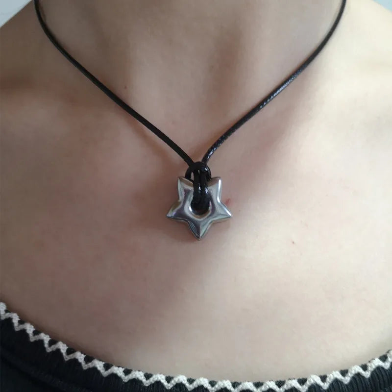 Cord necklace with hollow star pendant