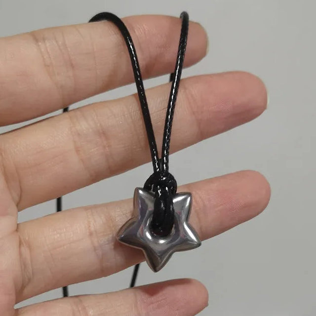 Cord necklace with hollow star pendant