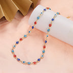 Choker necklace adorned with multiple blue and red blue eye charms
