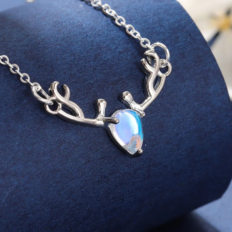 Necklace with antler wood pendant and iridescent blue moonstone
